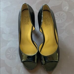 Like new patent leather heel from Naturalizer.  Heel is approximately 3 inches.